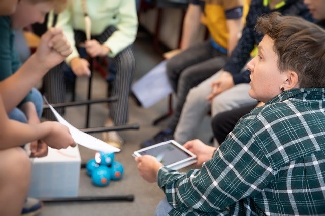 image of colleague coding with children.